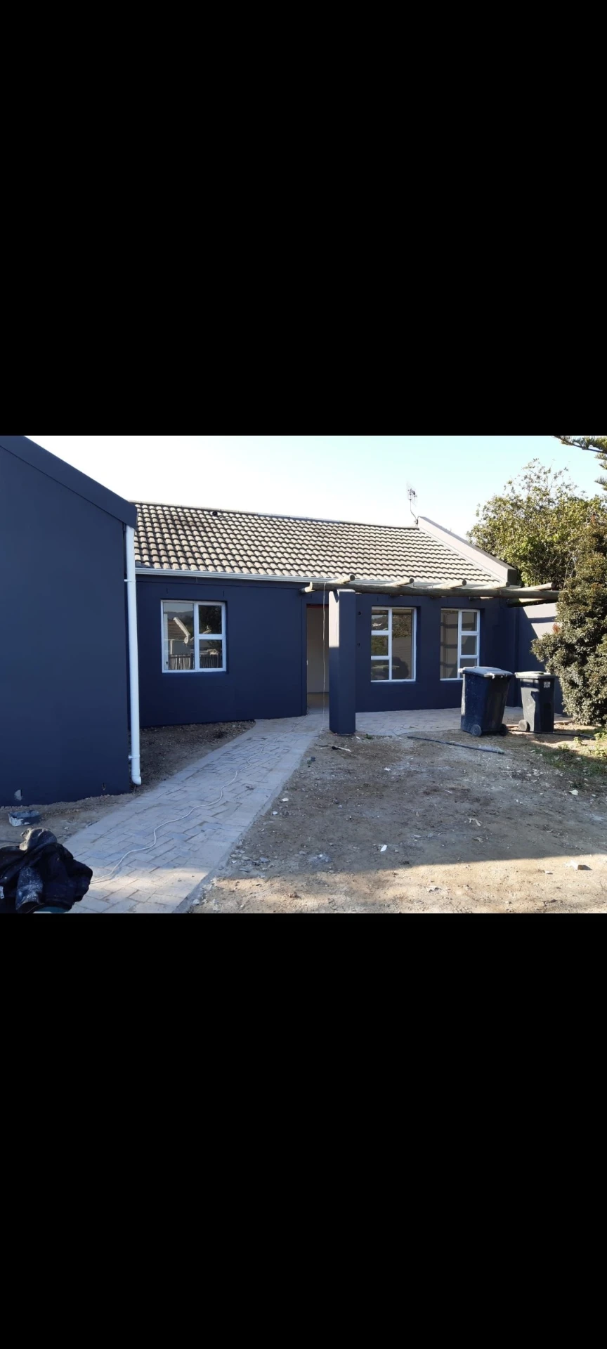 Exterior repaint and paved walkway on a Cape Town home